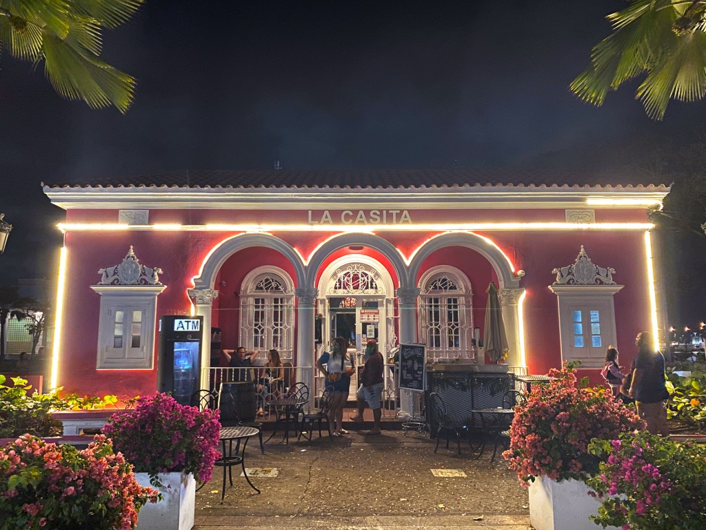 A small pink house with white trim in Old San Juan, Puerto Rico. It is now a bar named La Casita.