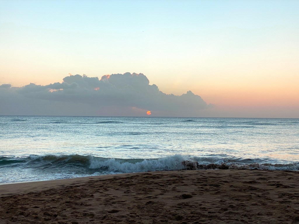The sun setting over the beach in Rincon, Puerto Rico.