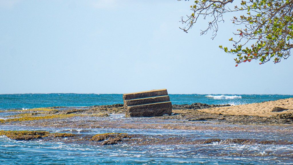 A set of concrete steps washed up on a beach in Rincon, Puerto Rico.