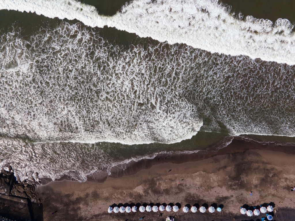 Canggu Beach, a black sand beach in Canggu, Bali famous for its world-class long board wave.