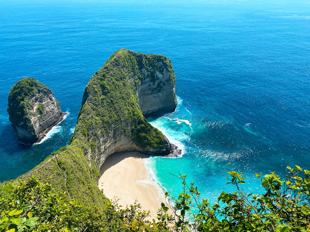 Kelingking Beach in Nusa Penida, a small island off of Bali, Indonesia. The rock formation resembles a T-Rex.