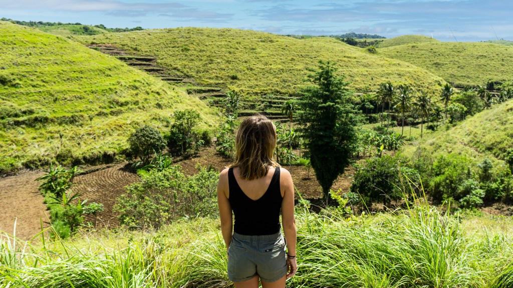 Teletubbies Hill in Nusa Penida, a small island off of Bali, Indonesia. Green, grassy hills in the country side of Nusa Penida.