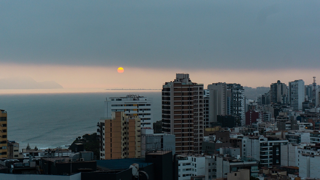 A skyline view of Lima, Peru during the sunset.