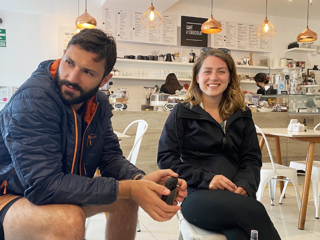 A man and a woman sitting in a cafe called Cafe Et Chocolat in Lima, Peru.