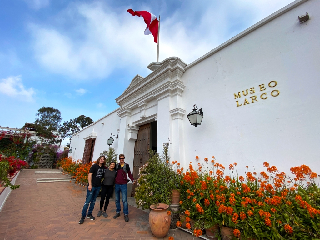 2 Men and 1 woman standing in front of the entrance to the Larco Museum in Lima, Peru.