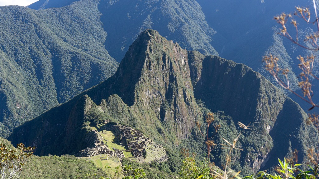 An aerial view of the Machu Picchu city ruins taken from the Machu Picchu Mountain peak.