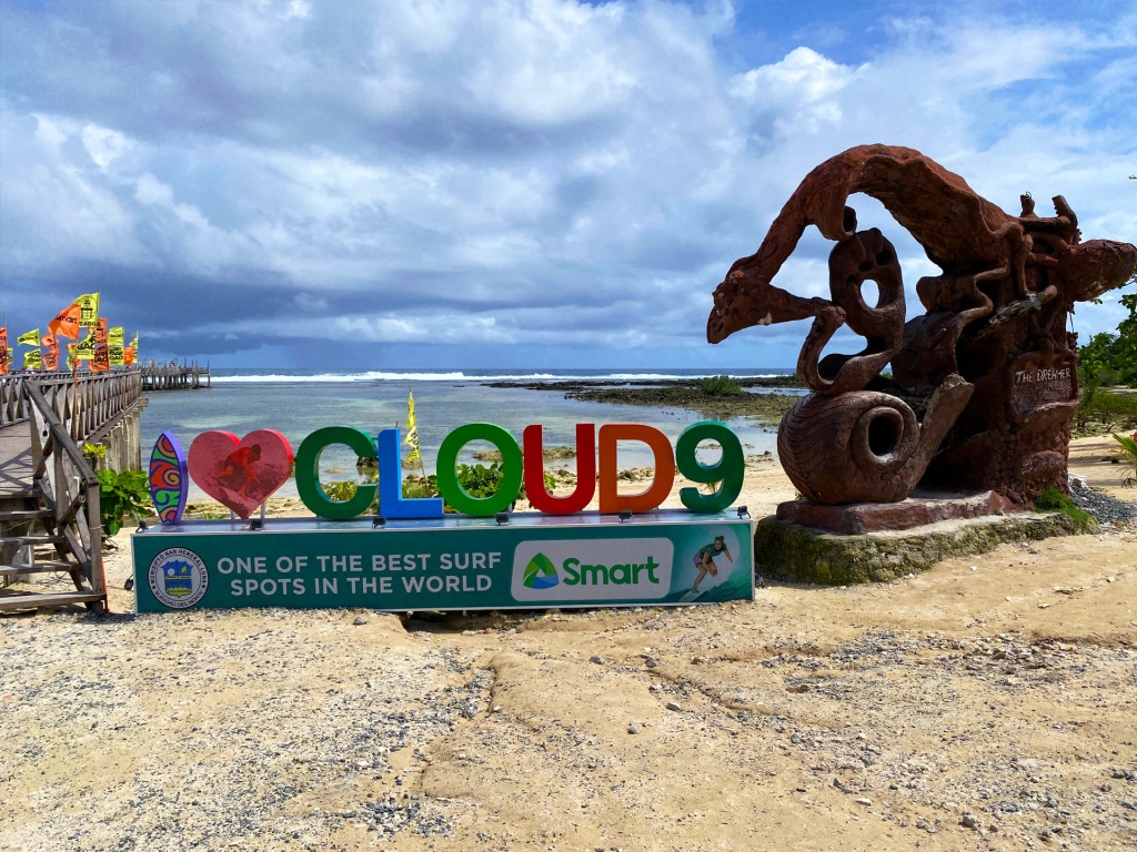 A sign in front of the Cloud 9 surf spot in Siargao, Philippines, which is known for its world-class waves.